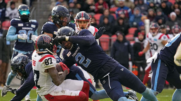 Nov 13, 2022; Toronto, Ontario, CAN; Toronto Argonauts defensive lineman Shawn Oakman (2) tackles Montreal Alouettes wide receiver Eugene Lewis (87) after a pass reception during the second half at BMO Field. Mandatory Credit: John E. Sokolowski-USA TODAY Sports